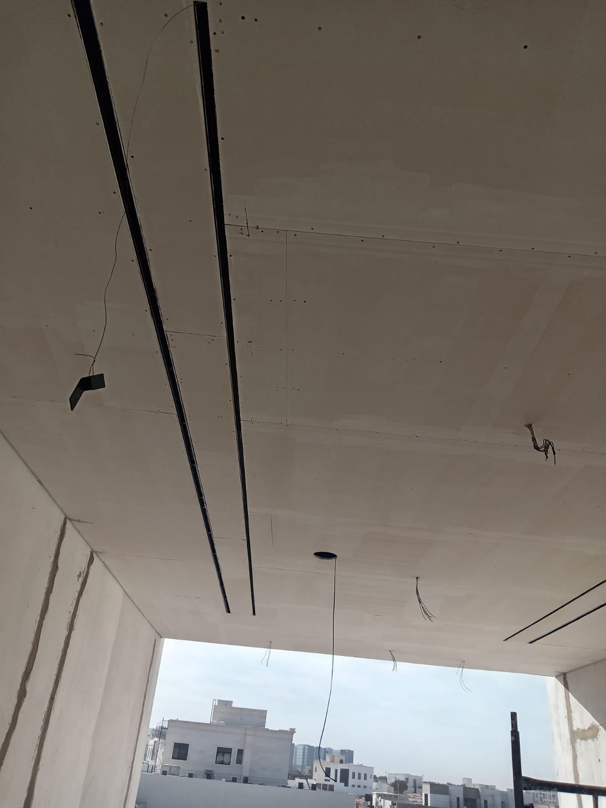 Plasterboard ceiling with track light channels, villa lighting design Dubai